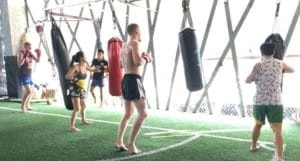 CMLocals Chiang Mai Locals Muay Thai ED Visa instructor leading training session demonstration in gym