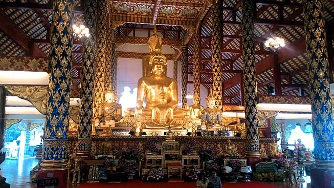 CMLocals Chiang Mai Locals Culture golden Buddha statue gleaming inside temple interior
